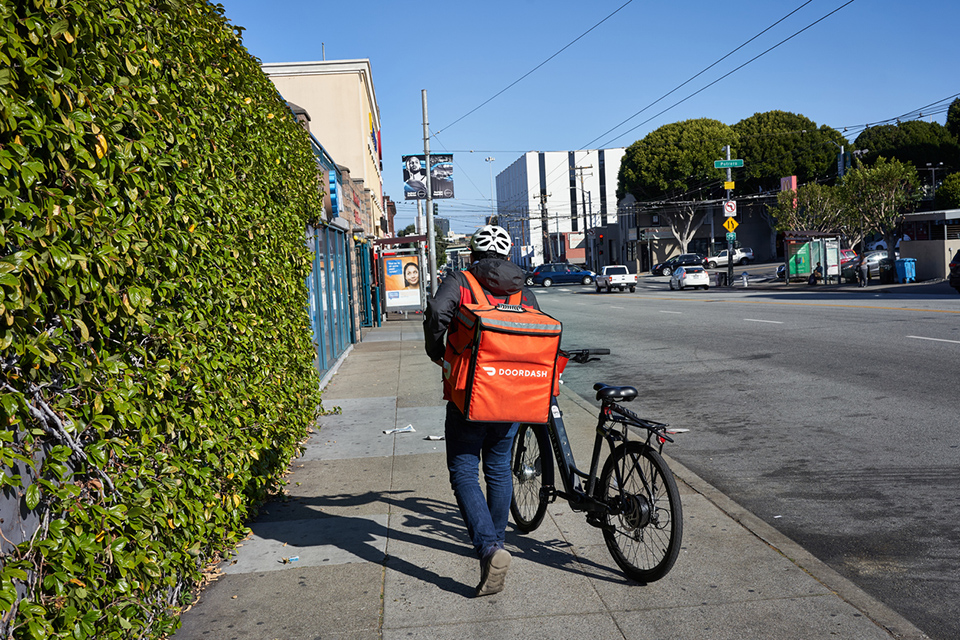 delivery person with bicycle